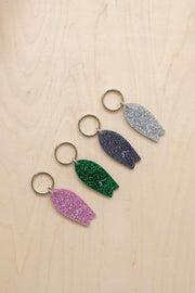 Surf keychain with wave pattern and sequins